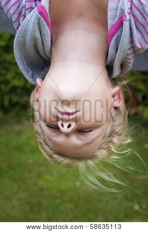 Child Hanging Upside Down