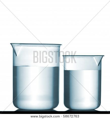 Isolated Chemical Plastic Beakers On Table With Solution
