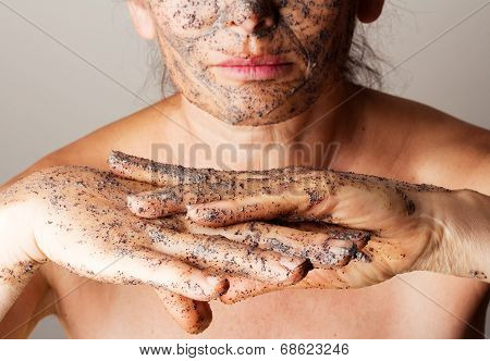 Mature woman making cosmetic mask