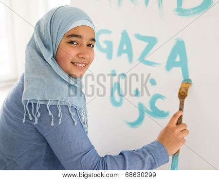 Arabic Muslim girl writing messages on board