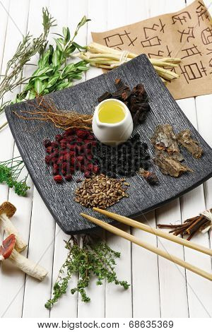 Traditional chinese herbal medicine ingredients with not real hieroglyphs, close-up