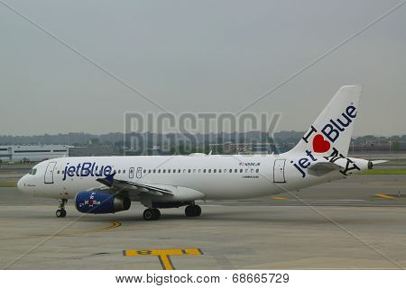 JetBlue Airbus A320 with NY's hometown airline tailfin design taxing at JFK Airport