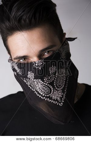 Man With His Face Hidden Behind A Bandanna