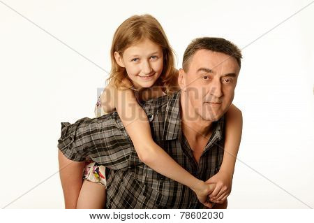 Twelve Year Old Daughter Hugging Her Father Sitting On His Back