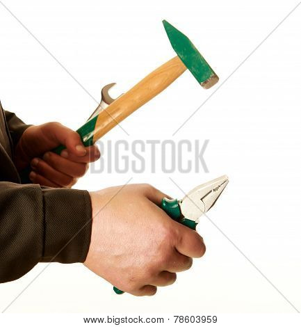 Pliers, A Spanner And A Hammer In The Hands Of The Working Man