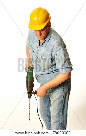 Worker In A Yellow Hardhat With Perforator
