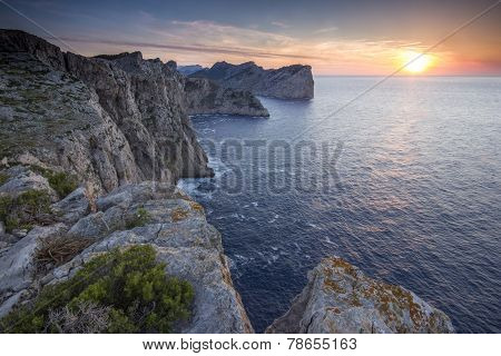 Watchig Sunset On The Cliffs Of Cap De Formentor