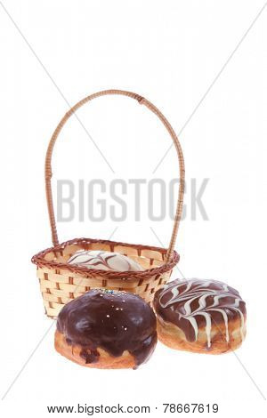 traditional jewish holiday chanuka donuts covered by dark and white chocolate pattern on retro vintage basket isolated on white background
