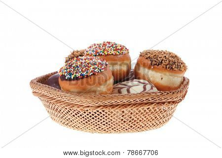 traditional jewish holiday chanuka donuts covered by dark chocolate on retro vintage basket isolated on white background