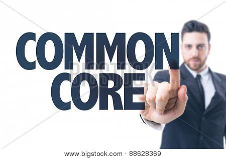 Business man pointing the text: Common Core