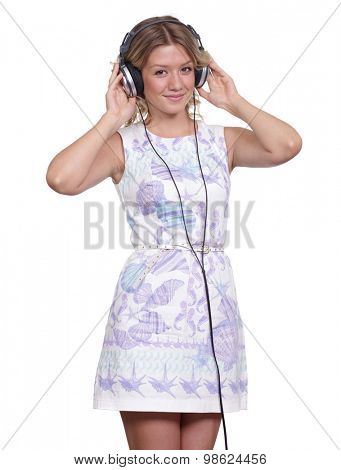 Happy young blonde woman listening to music, isolated on white