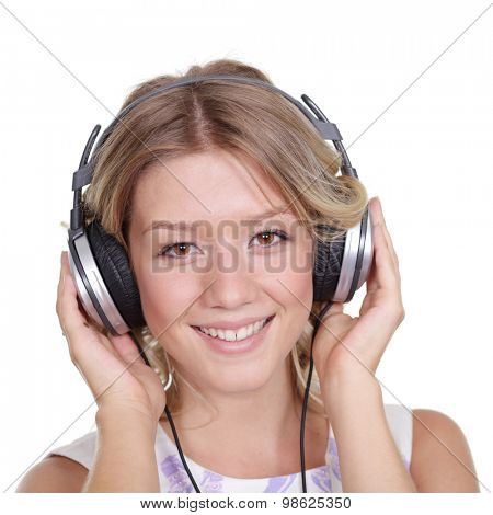 Happy young blonde woman listening to music, isolated on white