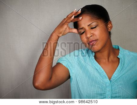 Stressed Woman Holding One Hand On Her Head