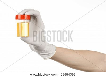 Medical Theme: Doctor's Hand In White Gloves Holding A Transparent Container With The Analysis Of Ur