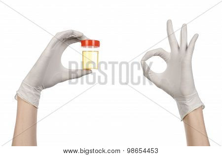 Medical Theme: Doctor's Hand In White Gloves Holding A Transparent Container With The Analysis Of Ur
