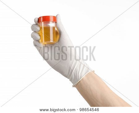 Medical Theme: Doctor's Hand In White Gloves Holding A Transparent Container With The Analysis Of Ur