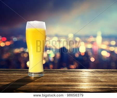 fresh  unfiltered beer and blured lighhts of Hong Kong