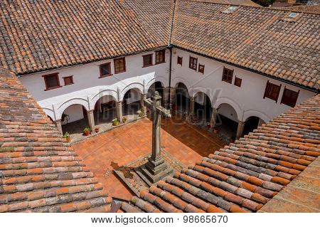 Spectacular shot from San Diego church Quito showing rooftops and backyard of building including pla