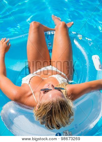 Top view of a  girl in the swimming pool