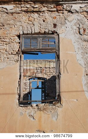 Looking through the windows of a derelict building at Emborio on the Greek island of Halki.