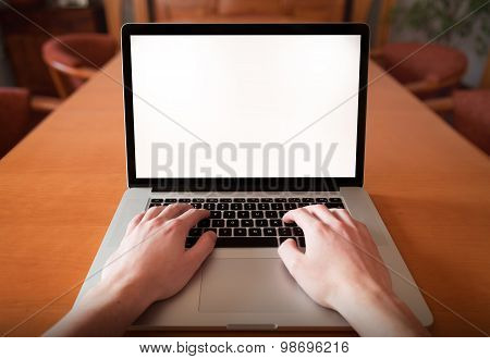Man hands working on the laptop, photo taken with first person view in livingroom