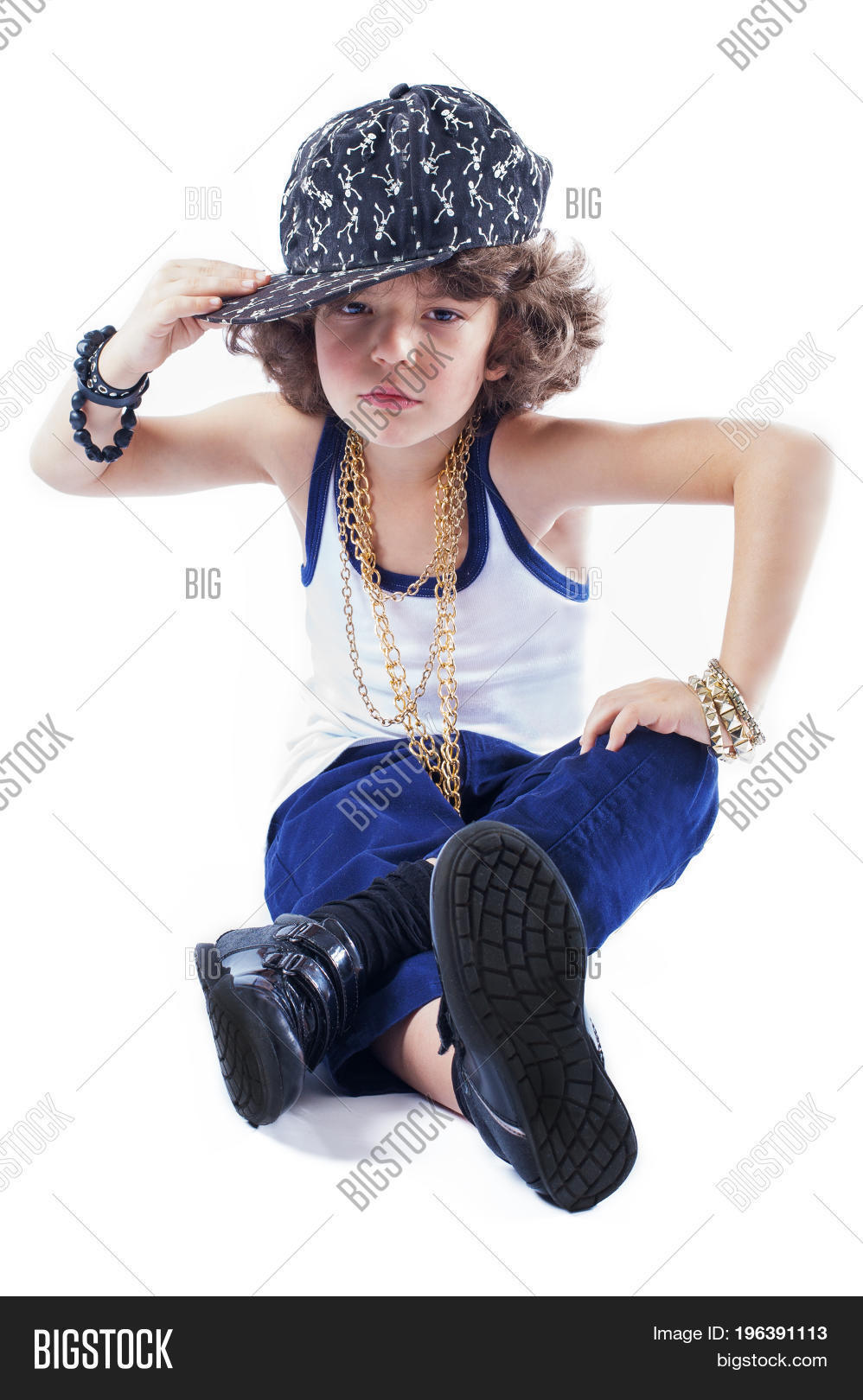 Funny Kinky Rapper Sitting On The Floor Holding His Hand Over The Visor Baseball Cap Looking Funny Kinky Rapper Sitting On The Floor Holding His Hand Over The Visor Baseball Cap Looking