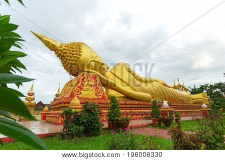 Reclining Buddha statue at Wat Pha That Luang Vientiane Laos.