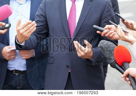 Media interview with business person, politician or spokesman