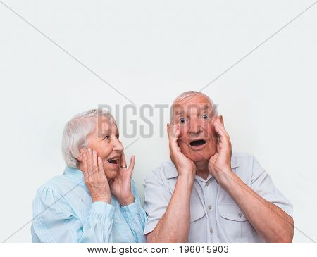 The elderly couple surprised by raising both hands at studio