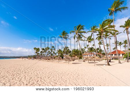 View Of The Sandy Beach In Punta Cana, La Altagracia, Dominican Republic. Copy Space For Text.