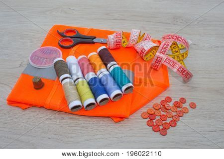 Furniture and equipment for sewing in designer sewing workshop. tools for sewing for hobby. instruments sewing craft on wooden background close up. tools for sewing for hobby
