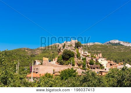 The Mountain Town Of Pratdip In Spain. Copy Space For Text. Isolated On Blue Background.