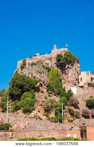 The Mountain Town Of Pratdip In Spain. Copy Space For Text. Isolated On Blue Background. Vertical.