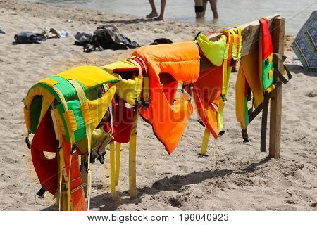 Colorful Life Jackets Save Your Life. Safety In Water. Rescue Service On The Beach. Injuries To Wate