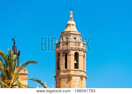 View Of The Tower Of The Church Of Sant Bartomeu And Santa Tecla In Sitges, Barcelona, Catalunya, Sp