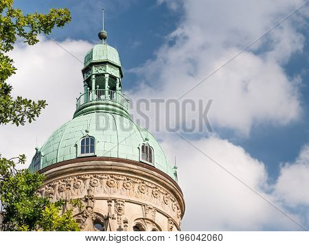 Copper plated roof of historic building with blue summer sky