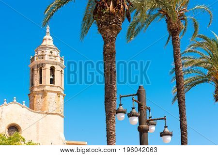 View Of The Tower Of The Church Of Sant Bartomeu And Santa Tecla In Sitges, Barcelona, Catalunya, Sp