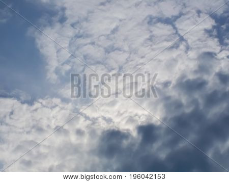 Dark clouds in a clear summer sky