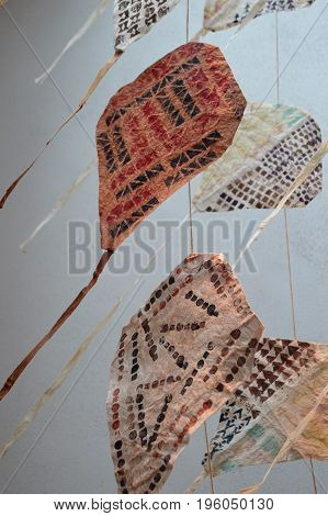 vertical image of a group of kapa kites