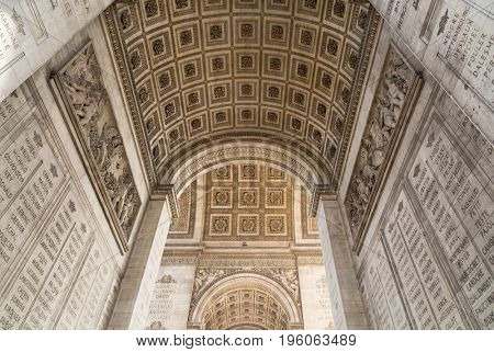 Arc de Triomphe in Paris under sky with clouds