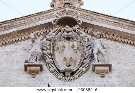 ROME, ITALY - SEPTEMBER 02: Coat-of-arms of France on the facade of Chiesa di San Luigi dei Francesi - Church of St Louis of the French, Rome, Italy on September 02, 2016.