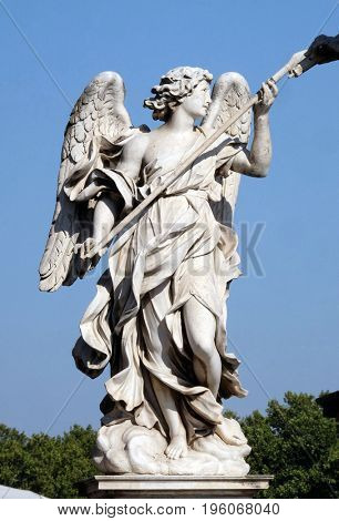 ROME, ITALY - SEPTEMBER 03: Statue of Angel with the Lance by Domenico Guidi, Ponte Sant Angelo in Rome, Italy  on September 03, 2016.