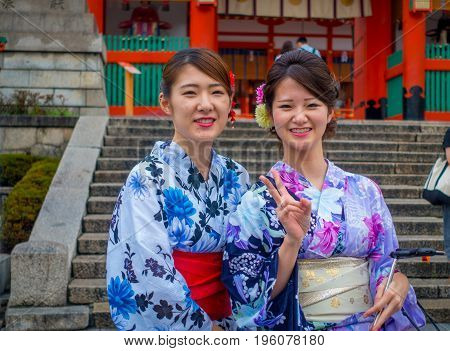 KYOTO JAPAN - NOVEMBER 24, 2016: Close up of tourists visit fushimi inari temple at rainy day in Kyoto, Japan.