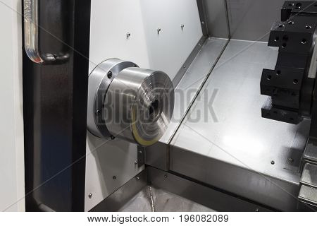 Inside CNC Lathe machine without workpice and tools;opern door