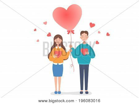 The couple are holding a heart balloon.