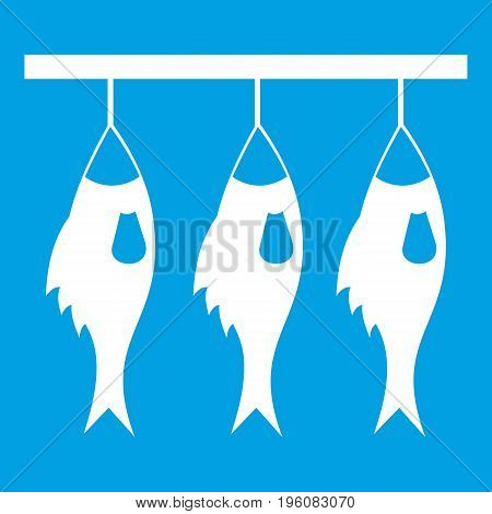Three dried fish hanging on a rope icon white isolated on blue background vector illustration