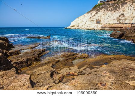 The grottoes of Rosh Ha Nikra on the Mediterranean coast in the north of Israel. Geological phenomenon on the border with Lebanon. Rocks of white limestone form caves, arches and grottoes