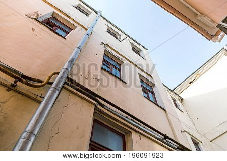 Old Apartment Buildings On Blue Sky Background