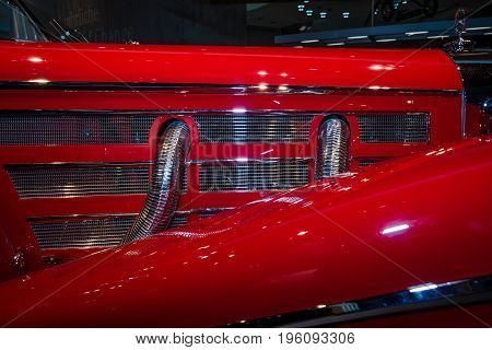 STUTTGART GERMANY- MARCH 19 2016: Exhaust system of luxury car Mercedes-Benz 500 K Special-Roadster (W29) 1937. Mercedes-Benz Museum.