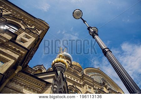 dome of the church against the blue sky in a clear summer weather